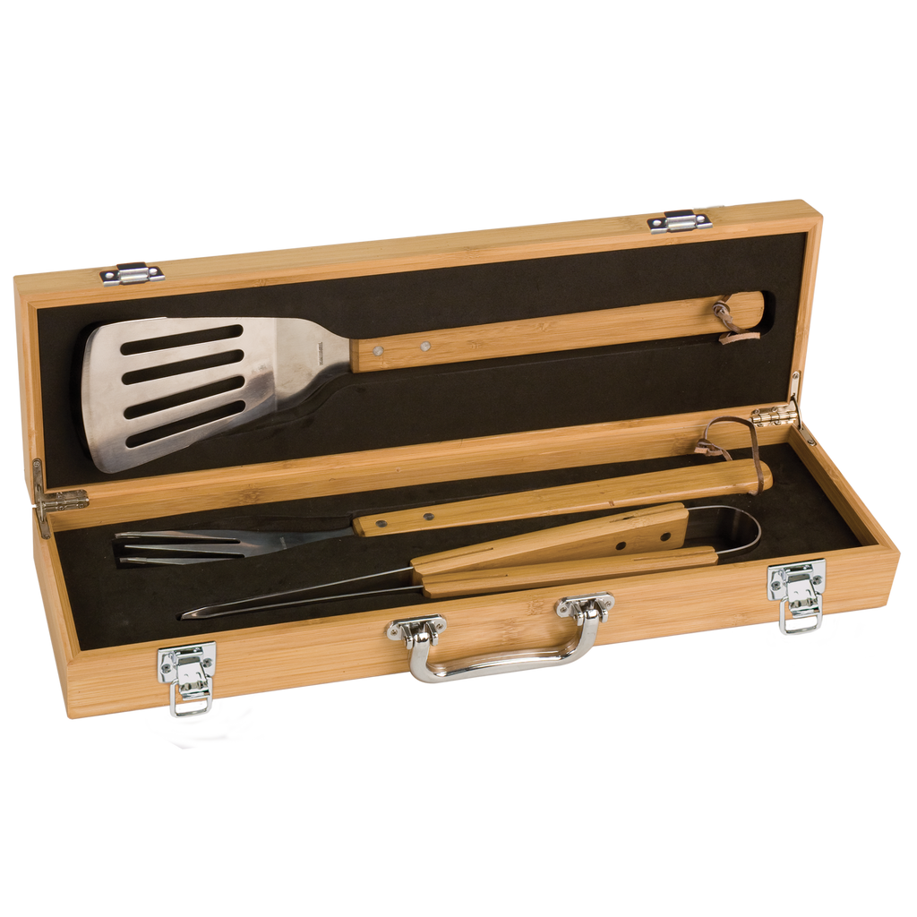 Set of barbecue tools in a wooden case on a white background