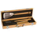 Set of barbecue tools in a wooden case on a white background