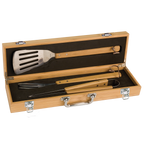 Set of barbecue tools in a wooden case on a white background