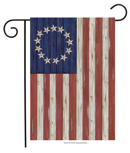 Decorative garden flag with wooden texture and star design on a blue background