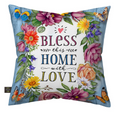 Decorative pillow with floral design and text 'Bless this home with love' on a white background