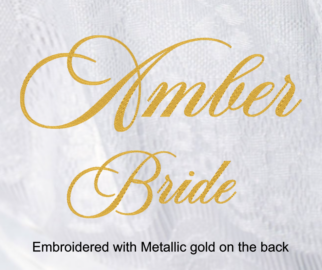 Gold text 'Amber Bride' on a white fabric background with metallic gold embroidery.