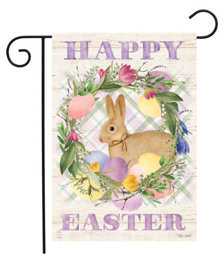 Easter-themed decorative flag with a bunny, eggs, and flowers on a wooden background.