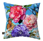 Decorative pillow with floral design and butterflies on a blue background