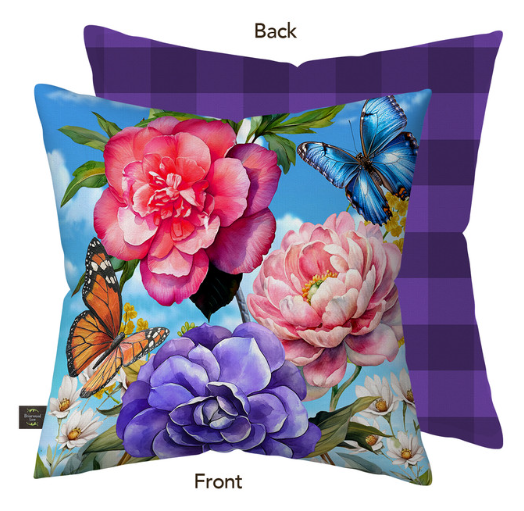 Floral and butterfly design pillow with checkered back on a white background