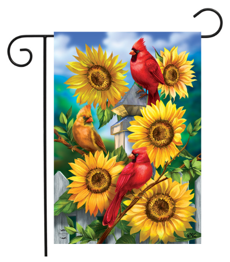 Decorative garden flag with cardinals and sunflowers on a blue sky background.