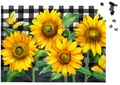 Sunflower design with a checkered border and puzzle pieces on a black background