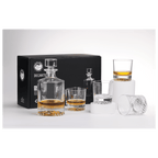 Whiskey decanter set with glasses on a white surface