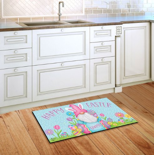 Decorative Easter mat with a gnome design on a wooden floor in a kitchen.