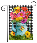 Decorative garden flag with a blue watering can filled with colorful flowers and butterflies on a checkered background.