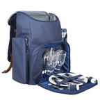 Blue picnic backpack with cutlery, plates, and glasses on a white background