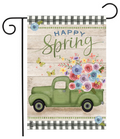Decorative garden flag with a vintage truck, flowers, and 'Happy Spring' text on a wooden background.