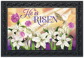 Easter-themed mat with flowers, dove, and 'He is Risen' text.