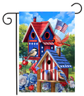 Decorative garden flag with birdhouses, birds, and American flags on a blue sky background.