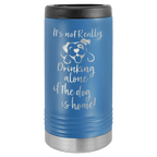 Blue travel mug with black lid and white text on a green background