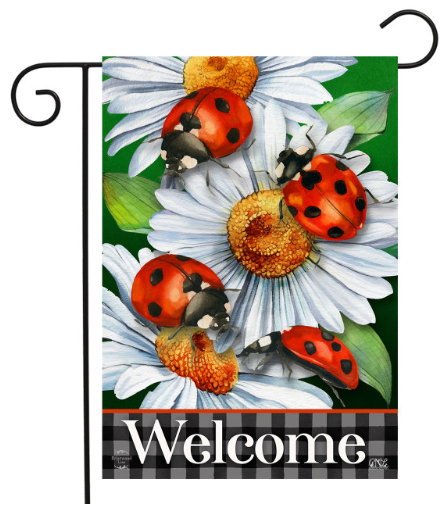 Decorative garden flag with ladybugs and daisies and the word 'Welcome'.