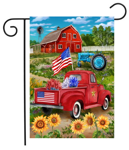 Decorative garden flag with a red truck, American flag, and barn in a rural setting.