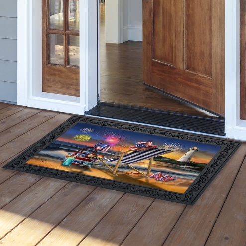 Decorative doormat with a beach scene design on a wooden floor.