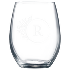 Clear glass tumbler with laser engraved design on a white background