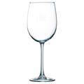 Clear wine glass with laser engraved monogram on a white background