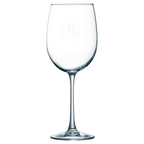 Clear wine glass with laser engraved monogram on a white background
