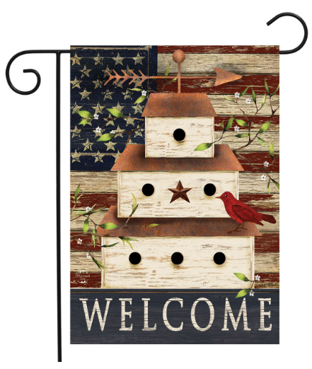 Decorative garden flag with birdhouses, cardinal, and American flag design on a wooden background.