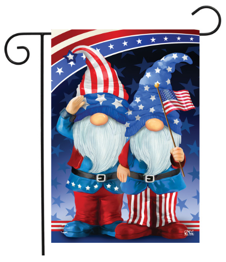 Decorative flag with two gnome characters wearing American flag hats and pants, holding a flagpole with an American flag.