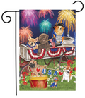 Decorative garden flag with dogs in a wagon and fireworks in the background