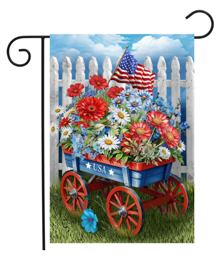 Decorative flag with a floral wagon, American flag, and 'USA' text against a blue sky with white clouds.