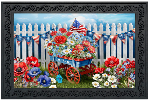 Decorative mat with a patriotic scene featuring a wagon, flowers, and American flags against a picket fence.