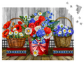 Three flower baskets with red, white, and blue flowers on a wooden surface.