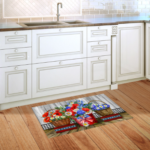 Decorative kitchen mat with floral design on a wooden floor in a kitchen setting.