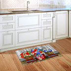 Decorative kitchen mat with floral design on a wooden floor in a kitchen setting.