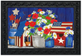 Decorative mat with flowers, stars, and an American flag design on a blue background.