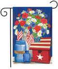 Decorative garden flag with flowers, American flags, and a birdhouse on a blue background.