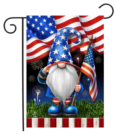 Gnome holding an American flag with fireworks and USA flag in the background
