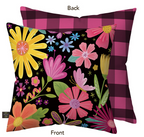 Floral-patterned pillow with checkered back on a white background
