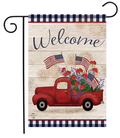 Decorative garden flag with a red truck, American flags, and fireworks on a wooden background.