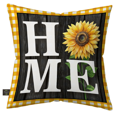 Decorative pillow with sunflower and 'HOME' text on a wooden background
