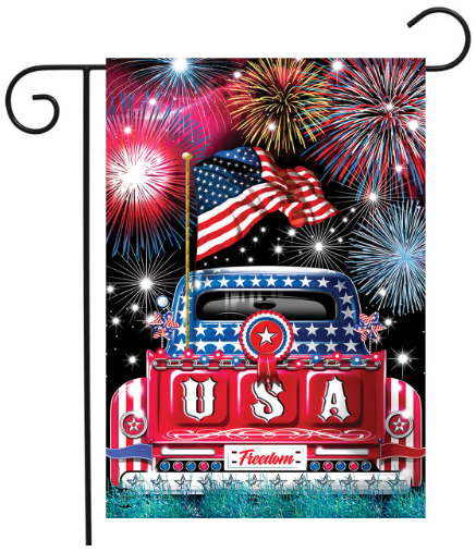 Decorative flag with a red truck, American flag, and fireworks on a black background