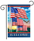 Decorative flag with American flags and an eagle, featuring the word 'Welcome', on a blue sky background.
