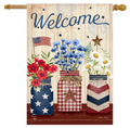Decorative flag with 'Welcome' text, flowers, and American flags on a wooden background.
