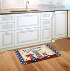 Decorative doormat with 'Welcome' text on a wooden floor in a kitchen.