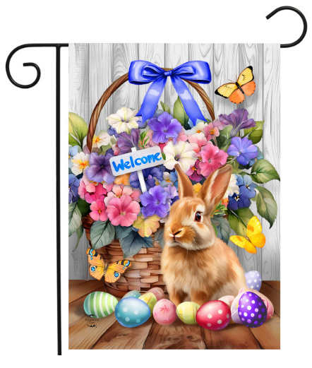 Decorative flag with a rabbit, flowers, and Easter eggs on a wooden surface.