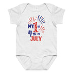 White baby onesie with 'My 1st 4th of July' text and fireworks design on a white background