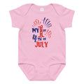 Pink baby onesie with 'My 1st 4th of July' text and fireworks design on a white background