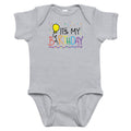 Gray baby onesie with colorful 'It's My Birthday' text and balloon design on a white background