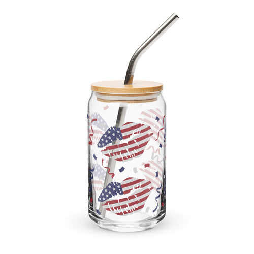 Glass tumbler with American flag design, wooden lid, and metal straw on a white background