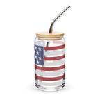 Clear glass jar with American flag design, wooden lid, and metal straw on a white background
