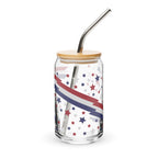 Glass jar with star and stripe pattern, wooden lid, and metal straw on a white background